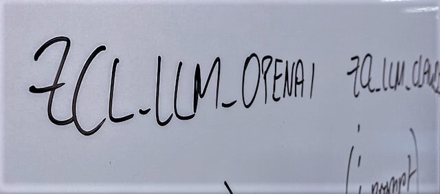 whiteboard with a black script